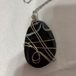 Black agate (onyx) wire-wrapped pendant. Silver-plated copper wire and chain
